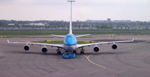 A 747 airplane at an airport. Did you get the cheapest ticket?